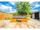 A stone patio in the backyard with a unique fireplace at 433 N 15Th Ave, Beech Grove, IN 46107