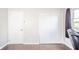 Bedroom with white closet and door with wood floors at 433 N 15Th Ave, Beech Grove, IN 46107