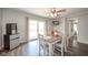 Dining room with light-colored chairs and sliding glass doors at 433 N 15Th Ave, Beech Grove, IN 46107