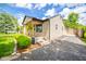 View of house with long driveway leading to a detached garage at 433 N 15Th Ave, Beech Grove, IN 46107