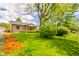 Single Gathering home offers a well-manicured front lawn and beautiful landscaping at 433 N 15Th Ave, Beech Grove, IN 46107