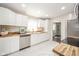 Bright kitchen featuring white cabinets, stainless appliances and butcher block countertops at 433 N 15Th Ave, Beech Grove, IN 46107