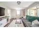 Cozy living room with hardwood floors, neutral paint, and lots of natural light at 433 N 15Th Ave, Beech Grove, IN 46107
