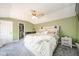 Cozy main bedroom featuring neutral tones, a ceiling fan, and an en suite bathroom at 433 N 15Th Ave, Beech Grove, IN 46107