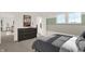 Serene bedroom with stylish dresser and bicycle-themed decor, creating a fun and inviting atmosphere for relaxation at 4355 Persian St, Greenwood, IN 46143