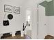 A bright entryway with coat rack and storage bench offers an organized and welcoming entrance to the home at 4355 Persian St, Greenwood, IN 46143