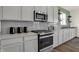 Close up on modern kitchen appliances and countertops, blending style and functionality at 4355 Persian St, Greenwood, IN 46143