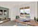 Bright study with a large window, a wooden desk, neutral walls, and stylish decor at 4355 Persian St, Greenwood, IN 46143