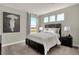 Comfortable bedroom with large window and neutral color scheme at 4372 Persian St, Greenwood, IN 46143