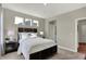 Cozy bedroom with neutral decor, ample natural light, and adjoining bathroom at 4372 Persian St, Greenwood, IN 46143