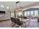 Open-concept dining area with modern light fixture and hardwood floors at 4372 Persian St, Greenwood, IN 46143