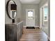 Inviting foyer with wood flooring, a console table, and a view of the exterior at 4372 Persian St, Greenwood, IN 46143