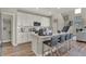 Gourmet kitchen featuring white cabinets, subway tile and quartz countertops at 4372 Persian St, Greenwood, IN 46143
