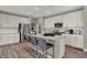 Kitchen featuring an island with seating, stainless steel appliances, and ample white cabinetry at 4372 Persian St, Greenwood, IN 46143