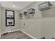 Functional laundry room with ample shelving and laminate flooring at 4372 Persian St, Greenwood, IN 46143