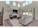Living room with soaring windows, stylish furniture, and a cozy fireplace at 4372 Persian St, Greenwood, IN 46143