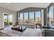 Well-lit living room with neutral color palette and sliding glass door at 4372 Persian St, Greenwood, IN 46143