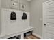 Mudroom with built in bench, storage cubbies, and coat hooks at 4372 Persian St, Greenwood, IN 46143