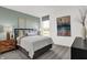 Cozy bedroom featuring a queen-size bed, soft lighting, and a tranquil atmosphere at 4400 Persian St, Greenwood, IN 46143