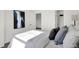Sun-drenched bedroom with large window and closet exhibits modern interior design at 4400 Persian St, Greenwood, IN 46143