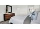 Comfortable bedroom showcasing a dresser and luxurious bedding at 4400 Persian St, Greenwood, IN 46143