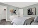 Bedroom with artwork on the walls and natural light exhibits a comfortable and inviting atmosphere at 4400 Persian St, Greenwood, IN 46143