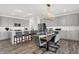 Modern dining room featuring stainless steel appliances and a large gray island with a view of the dining area at 4400 Persian St, Greenwood, IN 46143