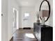 Bright entryway with hardwood floors, a front door with a glass insert, and white walls at 4400 Persian St, Greenwood, IN 46143