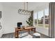 Bright home office featuring shiplap walls, a modern light fixture, and a large window at 4400 Persian St, Greenwood, IN 46143