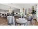 Open-concept living room and kitchen featuring modern gray cabinets and hardwood floors at 4400 Persian St, Greenwood, IN 46143