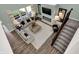 Airy living room with stylish furnishings, plush area rug, and cozy fireplace at 4400 Persian St, Greenwood, IN 46143