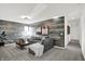 Relaxing living room with a comfortable gray sofa and a wood-paneled accent wall at 4400 Persian St, Greenwood, IN 46143