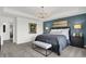 Beautiful main bedroom with stylish lighting, accent wall, and luxurious finishes at 4400 Persian St, Greenwood, IN 46143
