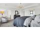 Bright main bedroom with artwork and a large window shows interior design with an inviting atmosphere at 4400 Persian St, Greenwood, IN 46143
