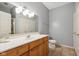 Bathroom with double vanity, modern lighting, and neutral tile flooring at 455 S Pine St # 4, Indianapolis, IN 46203