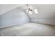 Spacious bonus room with light gray carpet and skylights, offering versatile space at 455 S Pine St # 4, Indianapolis, IN 46203