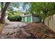 Detached garage with green doors in the back of the home at 455 S Pine St # 4, Indianapolis, IN 46203