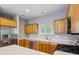 The kitchen features stainless steel appliances and ample counter space with wooden cabinets at 455 S Pine St # 4, Indianapolis, IN 46203