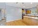 Bright open kitchen with wooden cabinets, stainless steel appliances, and an island at 455 S Pine St # 4, Indianapolis, IN 46203
