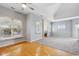 Combination living space with hardwood and carpet flooring, great windows and a small fireplace at 455 S Pine St # 4, Indianapolis, IN 46203