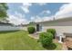 Backyard featuring a sliding glass door, concrete patio, and a privacy fence in the background offering a secluded outdoor space at 4641 Autumn Ridge Dr, Columbus, IN 47203