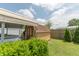 Backyard shed with an attached carport providing covered parking, surrounded by well-maintained landscaping and partial privacy fence at 4641 Autumn Ridge Dr, Columbus, IN 47203