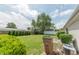 Wide backyard featuring a well-maintained lawn, privacy fencing, mature trees, and landscaping, complete with trash receptacle at 4641 Autumn Ridge Dr, Columbus, IN 47203
