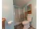 Well-lit bathroom with a shower stall, toilet, and vanity with storage space for bathroom essentials at 4641 Autumn Ridge Dr, Columbus, IN 47203