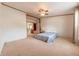 Spacious bedroom featuring a ceiling fan and an en-suite bathroom for added privacy and convenience at 4641 Autumn Ridge Dr, Columbus, IN 47203