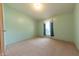Cozy bedroom with a window, carpet flooring, and fresh neutral decor for a tranquil retreat at 4641 Autumn Ridge Dr, Columbus, IN 47203