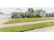 Charming single-story home featuring manicured lawn and mature landscaping at 4641 Autumn Ridge Dr, Columbus, IN 47203