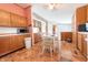 Eat-in kitchen featuring wooden cabinets, breakfast nook, and modern appliances at 4641 Autumn Ridge Dr, Columbus, IN 47203