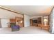 Cozy living room with built-in entertainment center, and plush recliner at 4641 Autumn Ridge Dr, Columbus, IN 47203