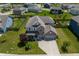 Aerial view of a beautiful home with manicured lawn, mature trees, and a three-car garage in a suburban neighborhood at 4863 Sherlock Dr, Westfield, IN 46062